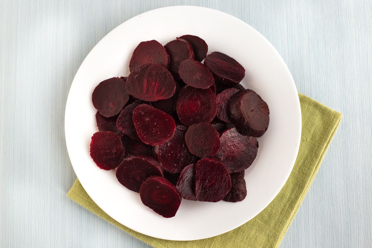 A plate of sliced beetroot.