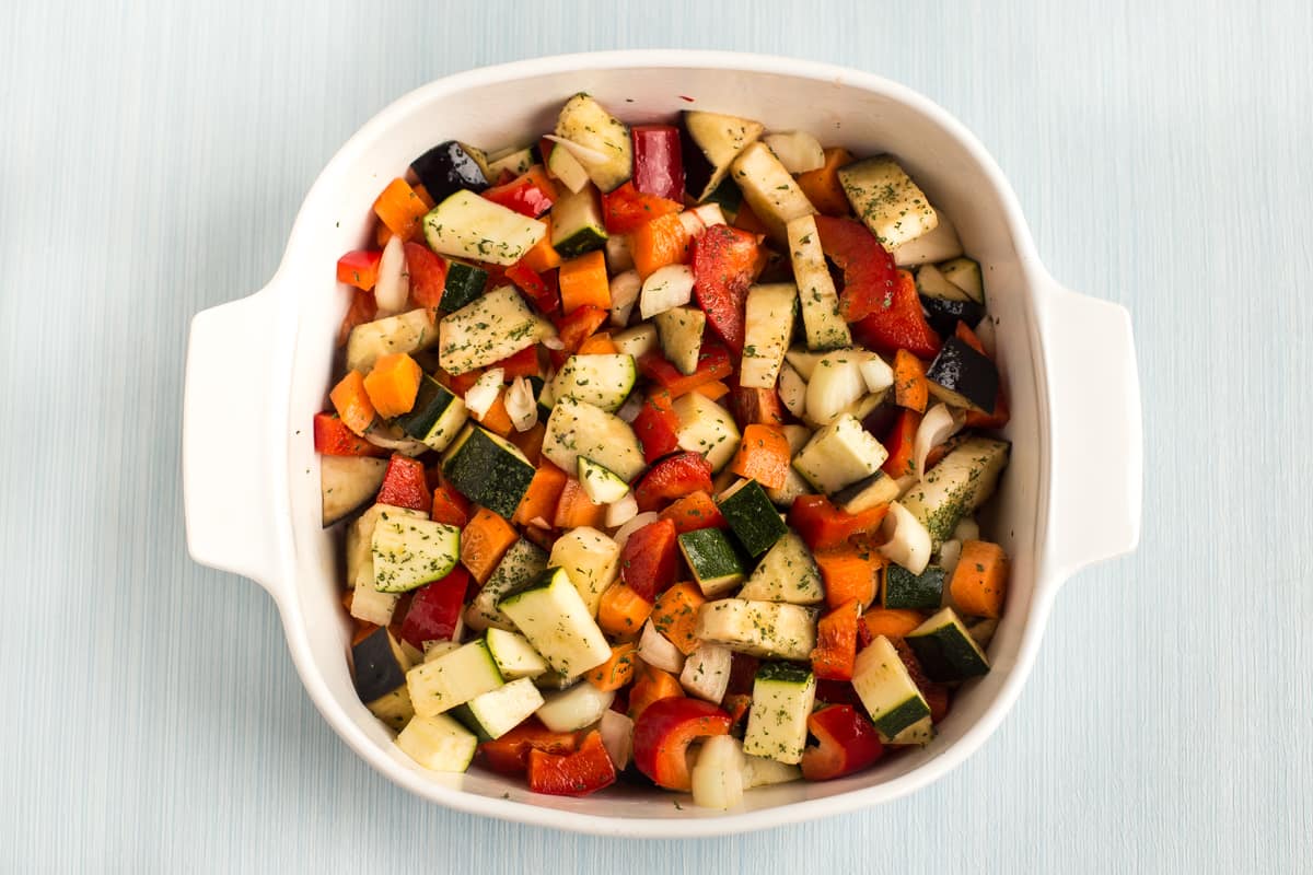 Chopped vegetables in a baking dish.