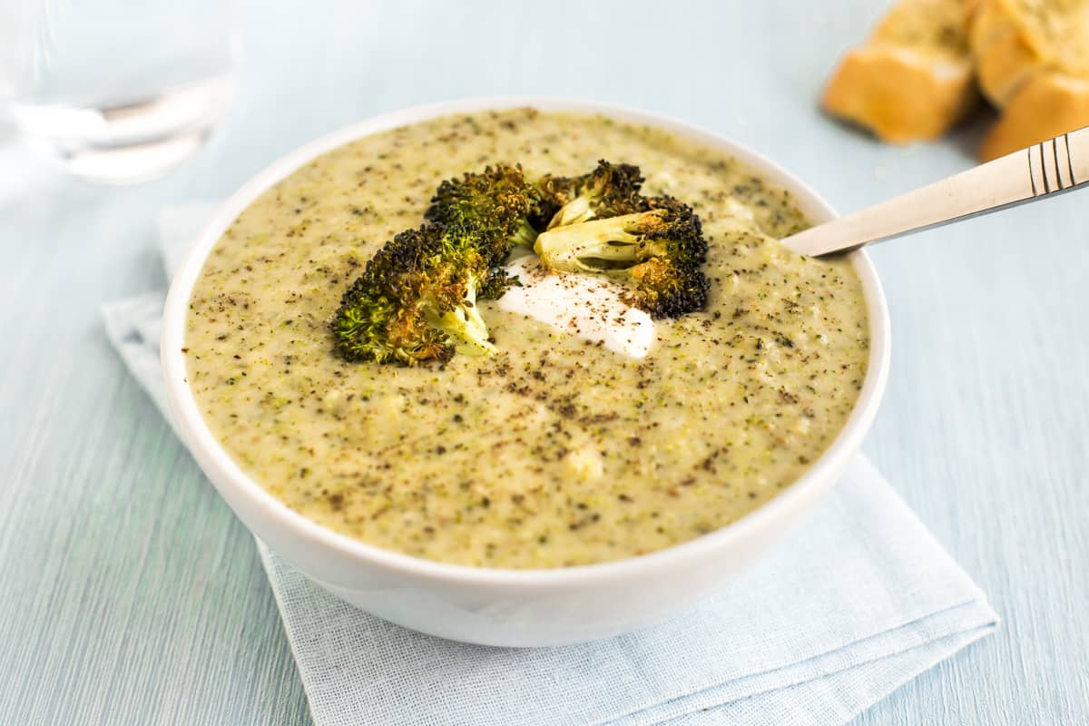 Roasted broccoli soup in a white bowl.