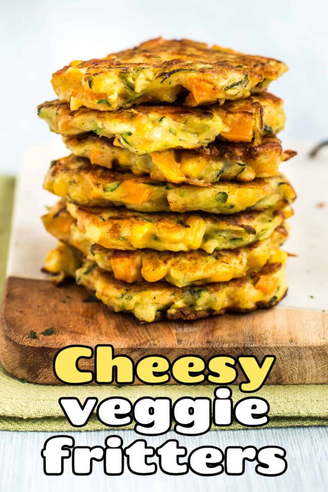 A tall stack of vegetable fritters on a board.