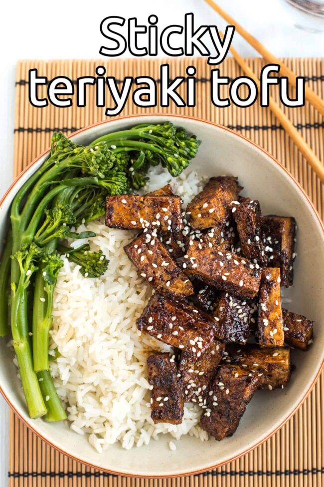 Aerial shot of sticky teriyaki tofu in a bowl with rice and Tenderstem broccoli.