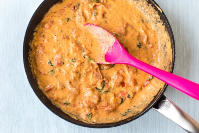 Ultra creamy tomato and mascarpone sauce in a frying pan.