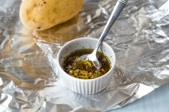 Garlic and herb butter in a ramekin.