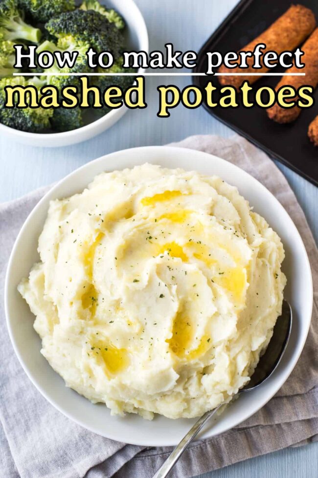 A bowl of creamy mashed potatoes topped with butter.