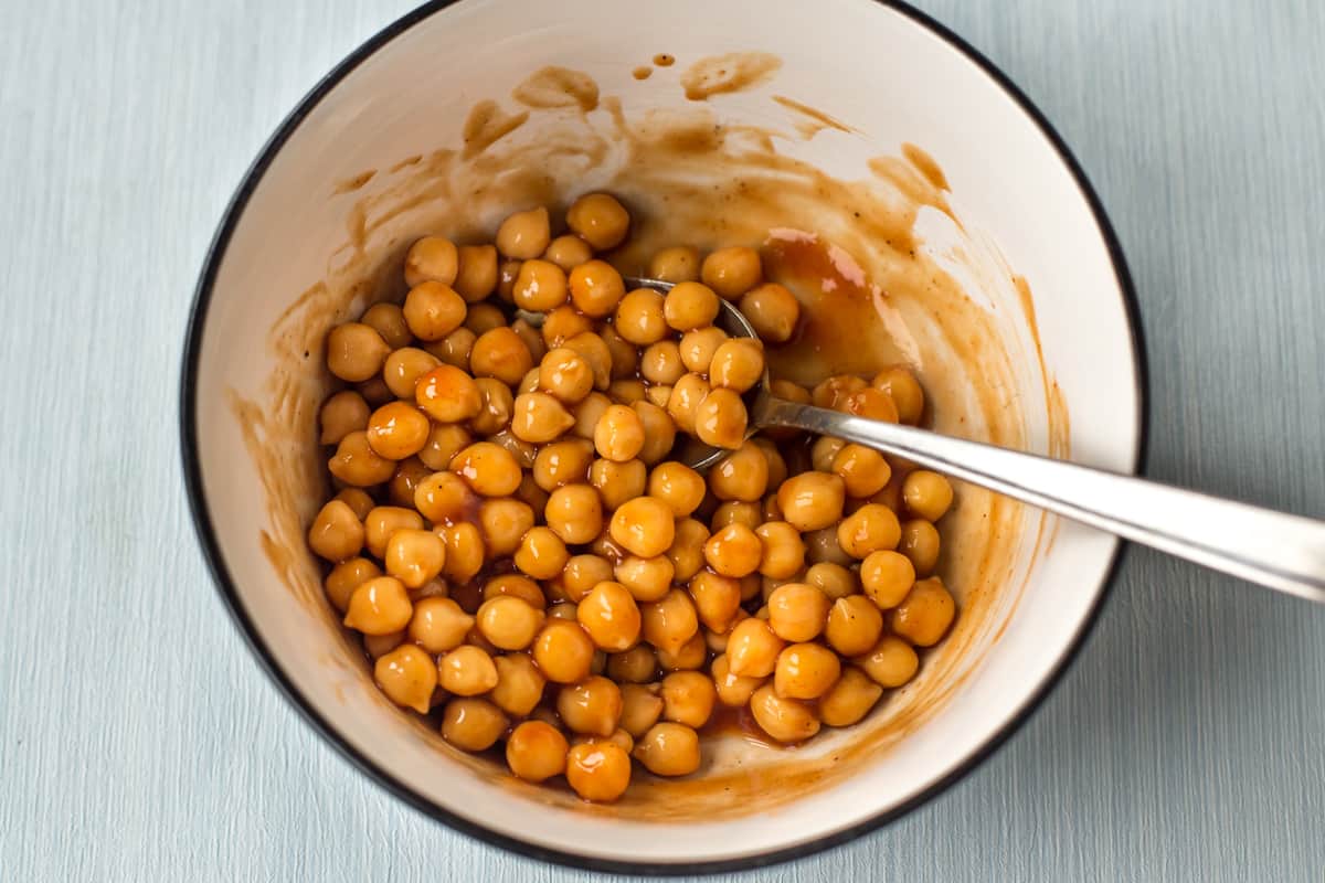 Chickpeas and BBQ sauce mixed in a bowl.