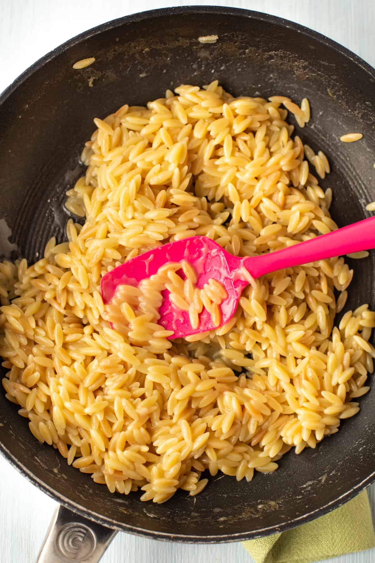Creamy orzo risotto in a pan.