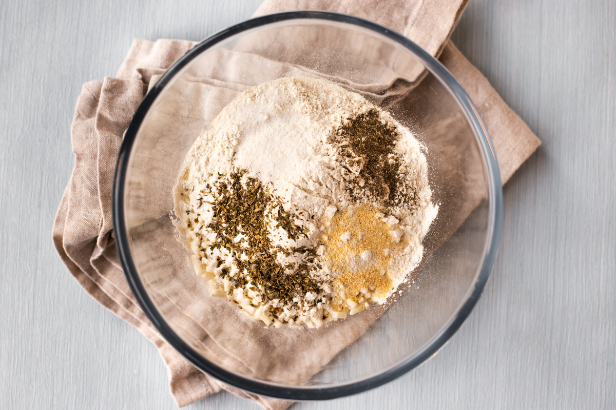 Seasonings and herbs with flour in a bowl.