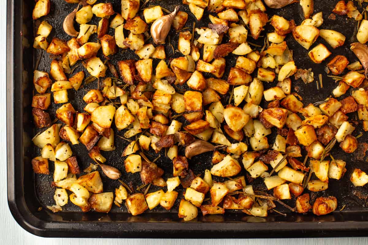 Crispy Parmentier potatoes on a baking tray.