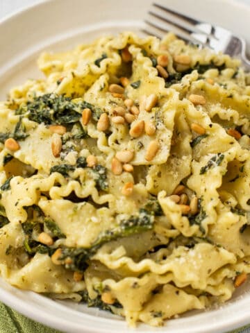 Mafalde pasta with spinach and pine nuts.