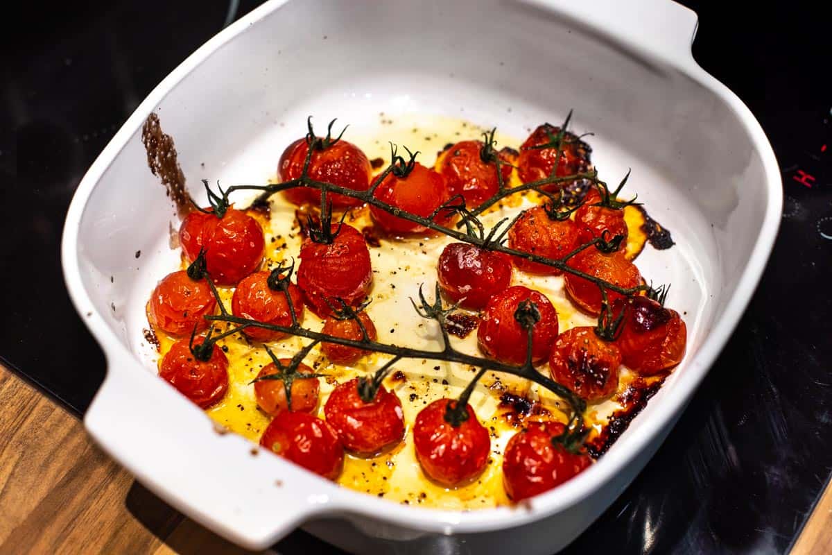 Roasted tomatoes in a baking dish.