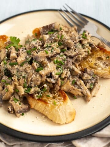Creamy mushrooms on toast, topped with fresh chives.