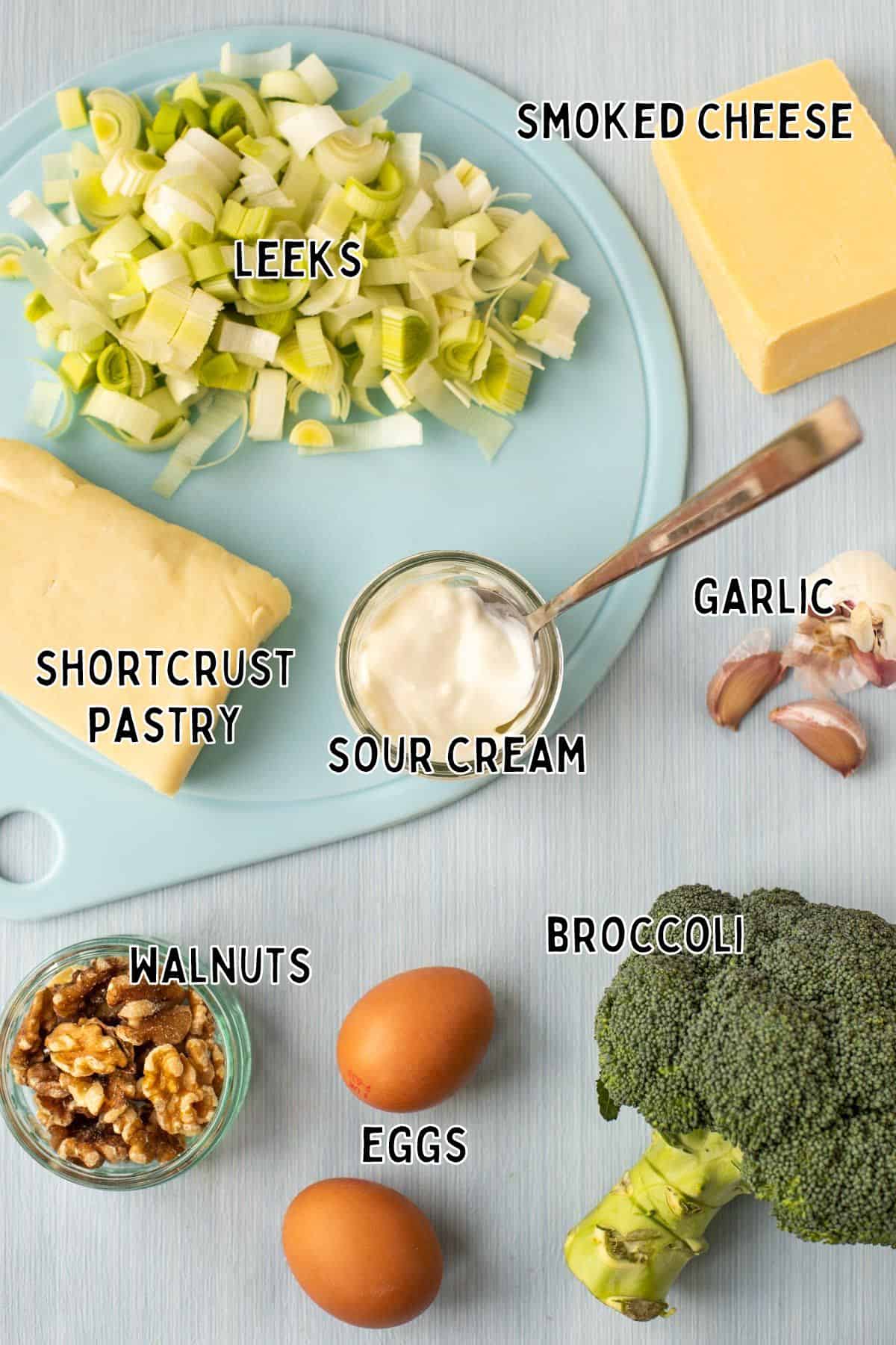 Ingredients for cheese and broccoli tart, with text overlay.