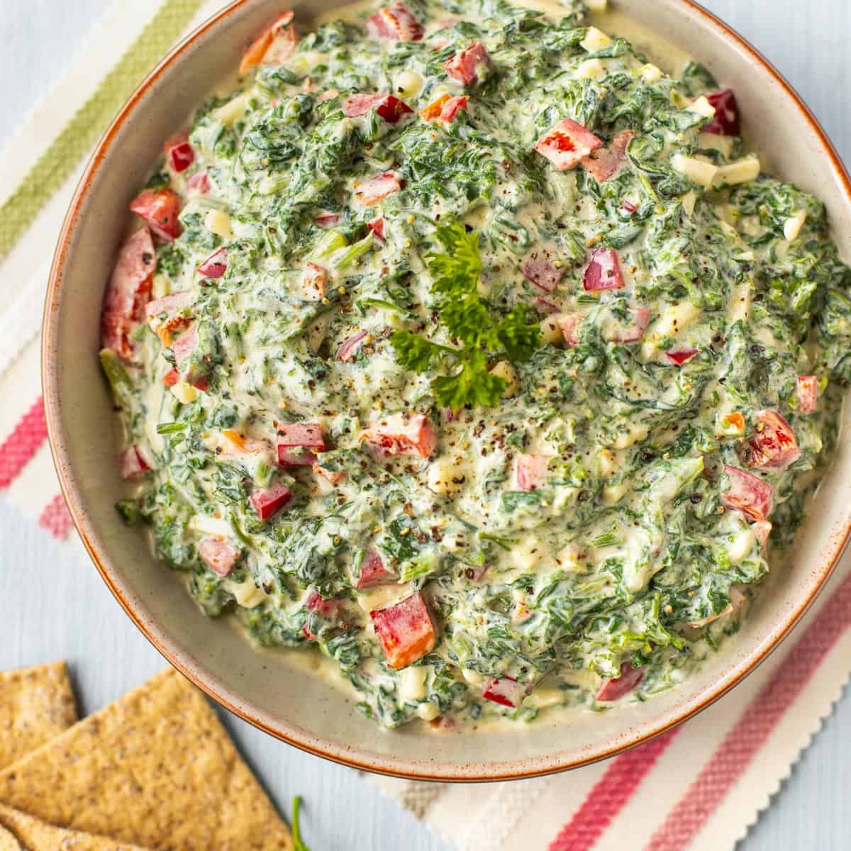 Creamy spinach dip in a bowl.