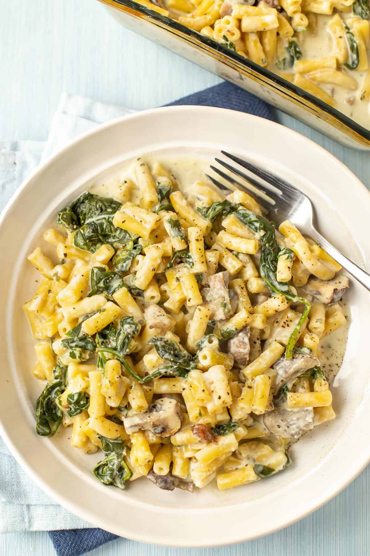 A bowlful of creamy Boursin pasta with mushrooms and spinach.