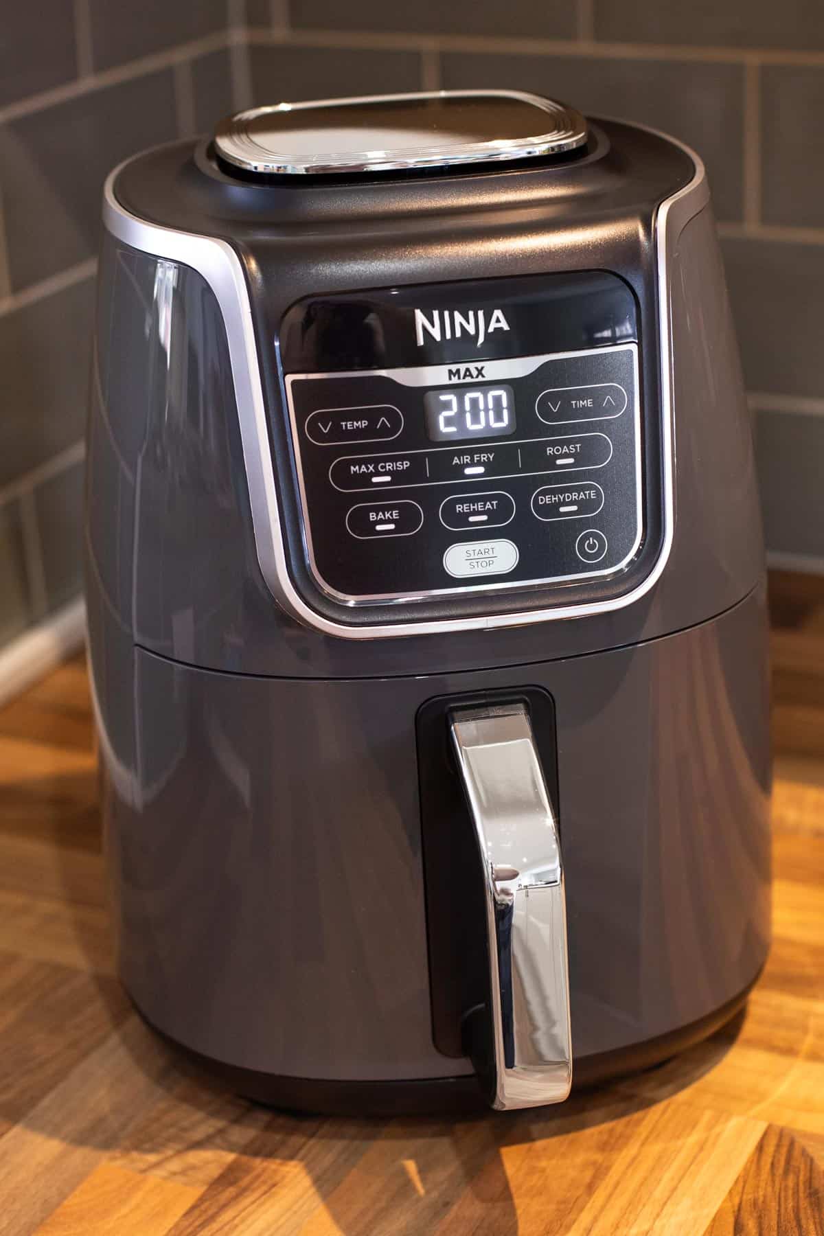 Ninja Air Fryer Max on a kitchen counter.