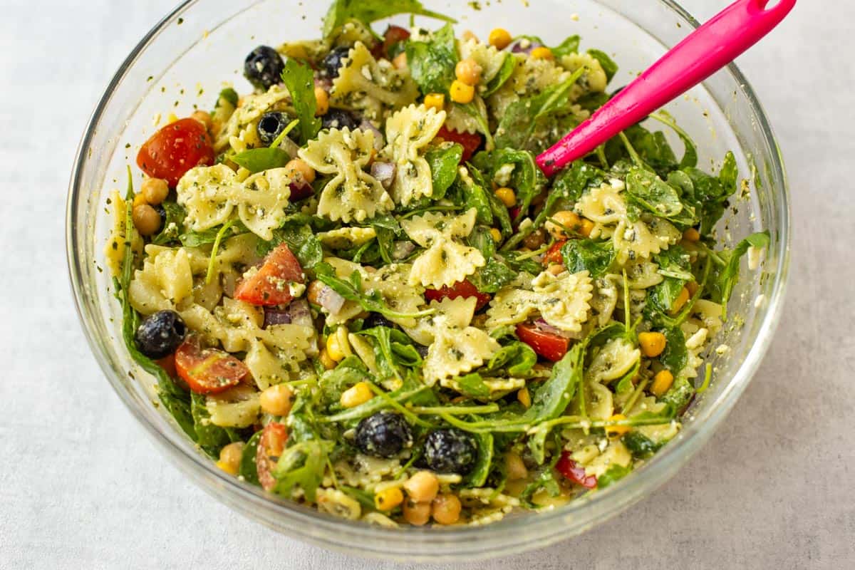 Fresh chickpea pasta salad in a mixing bowl.