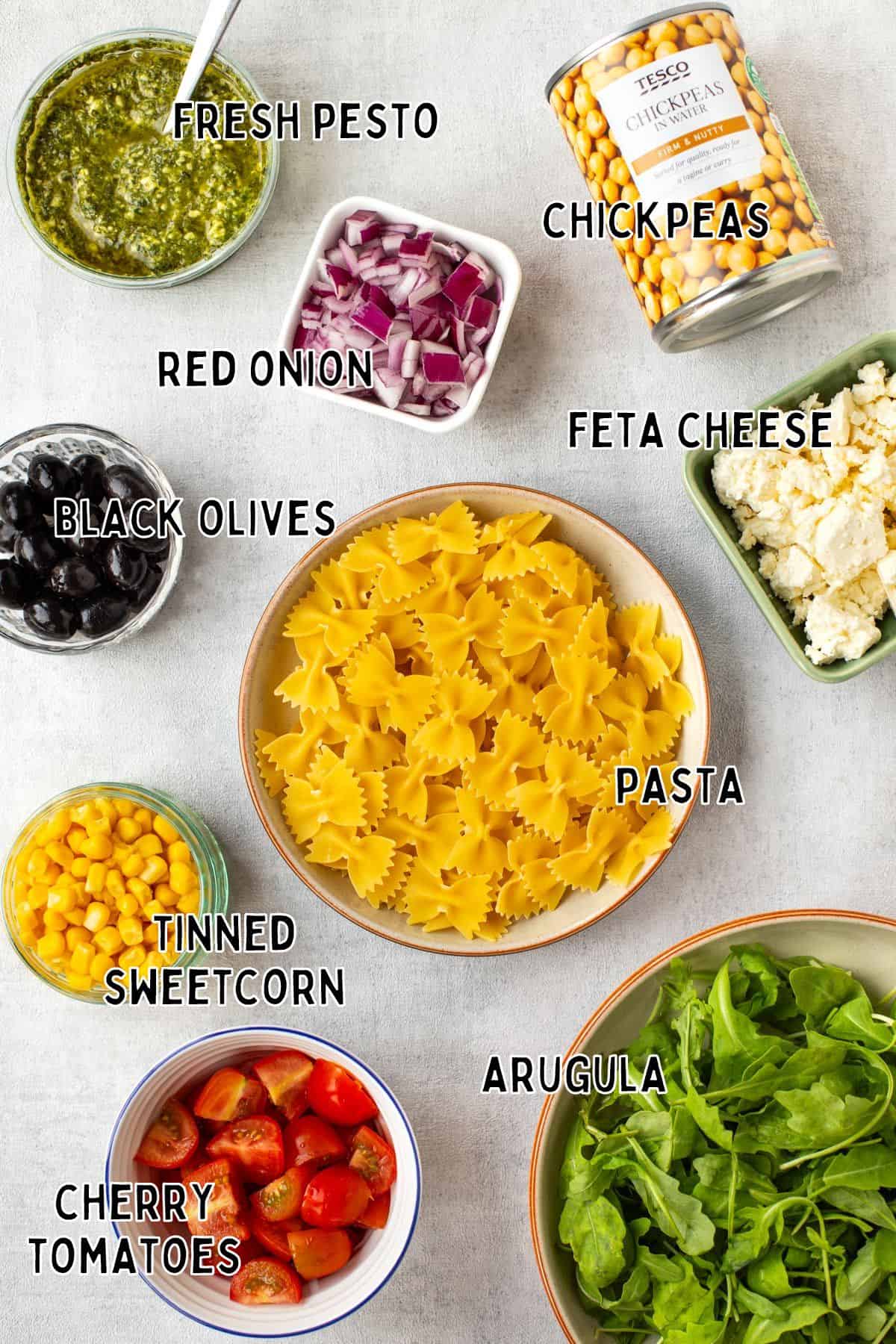 Ingredients for chickpea pasta salad with text overlay.