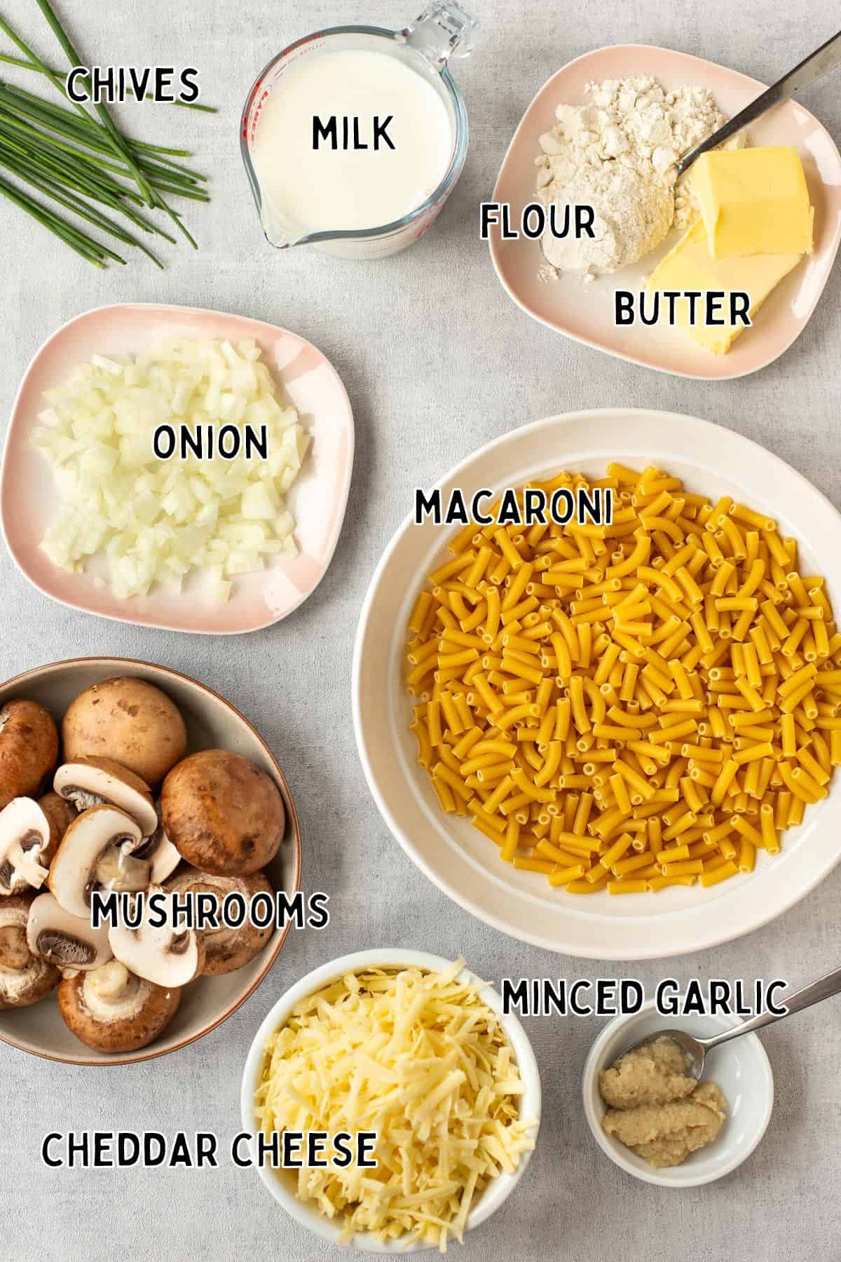 Ingredients for garlic mushroom mac and cheese with text overlay.