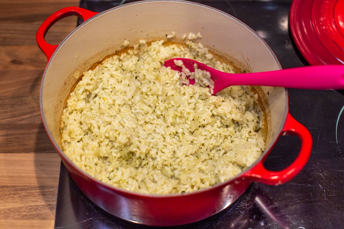 Part-cooked baked risotto with pesto.