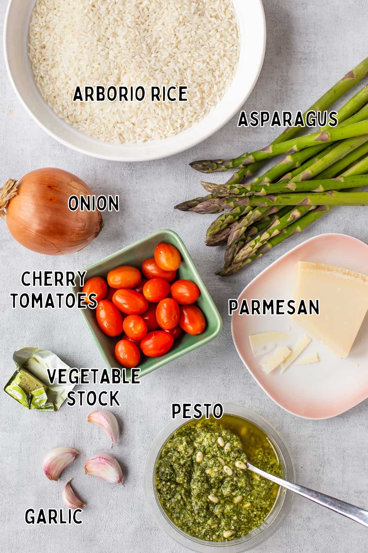 Ingredients for baked asparagus risotto laid out with text overlay.
