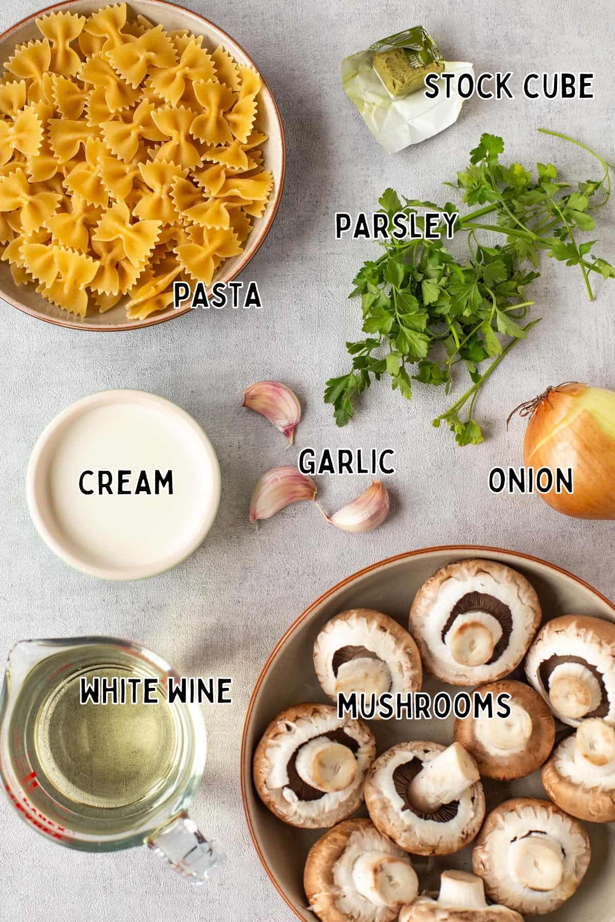 Ingredients for white wine pasta sauce laid out with text overlay.