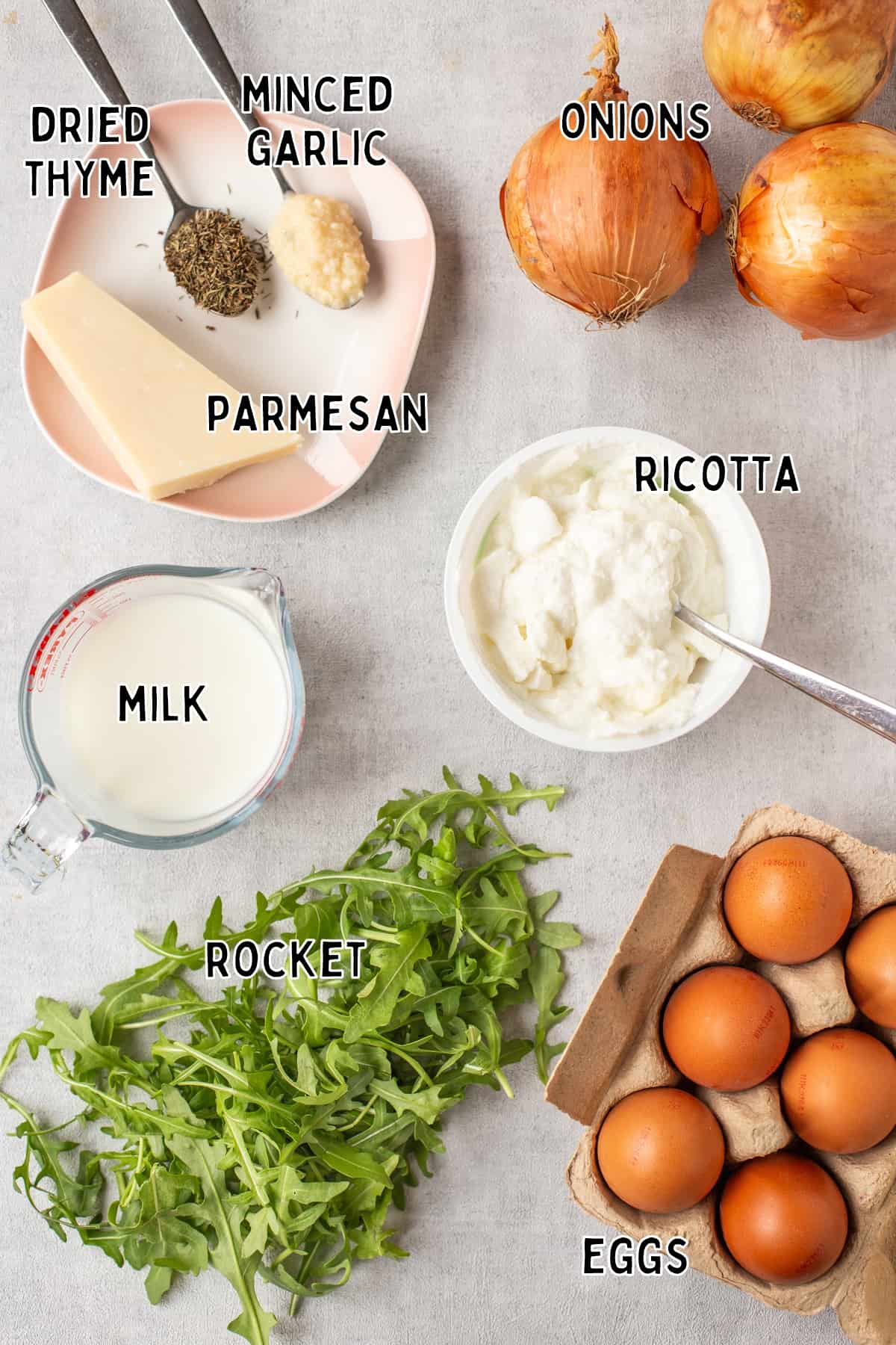 Ingredients for onion and ricotta frittata laid out with text overlay.