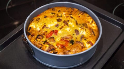 Vegetarian crustless quiche in a springform cake tin.