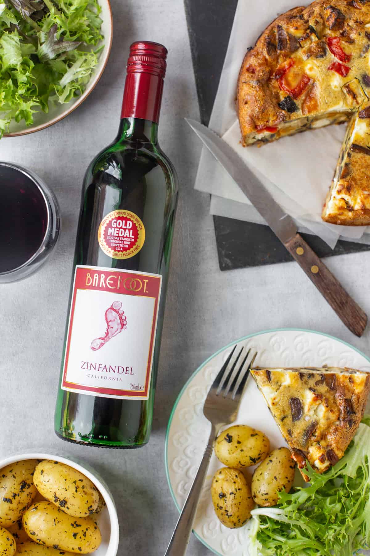 Barefoot wine laid on a table with crustless quiche.