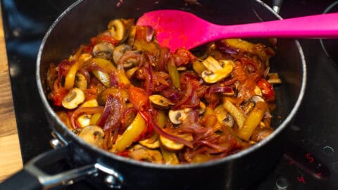 Mediterranean vegetables cooking in a frying pan.