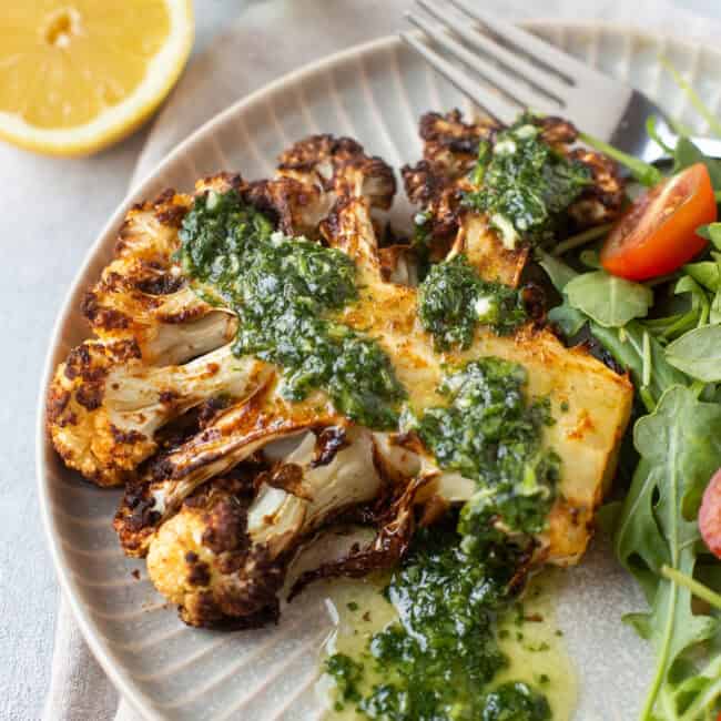 An air fryer cauliflower steak with lemon cilantro dressing.