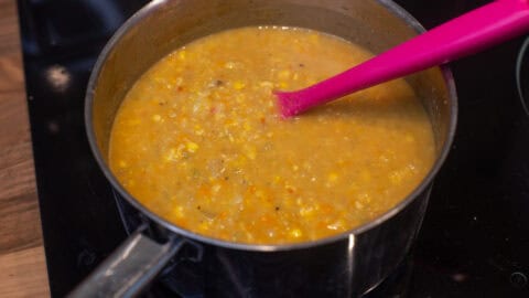 Vegan coconut corn chowder in a saucepan.