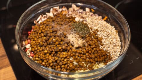 Raw ingredients for nut roast in a large bowl.
