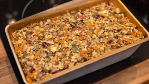 Uncooked nut roast in a loaf tin.