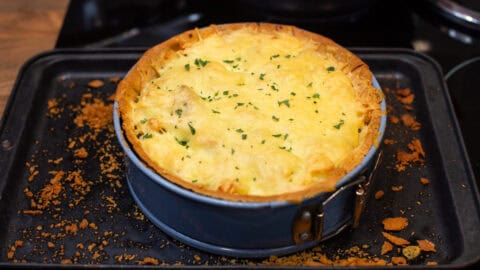 A cheesy pie in a cake tin.