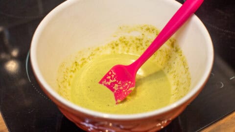 Watered down pesto in a mixing bowl.
