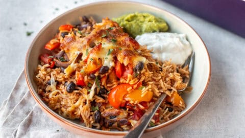 Cheesy baked rice with vegetables and black beans.