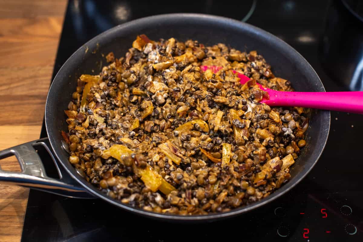 Creamy lentil stroganoff in a frying pan.