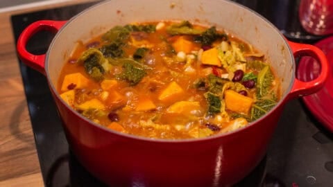 A Caribbean-style sweet potato stew in a large pot.