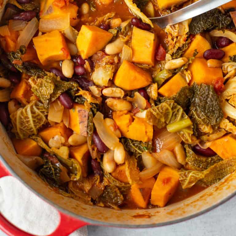 Sweet potato and cabbage stew in a large casserole pot.