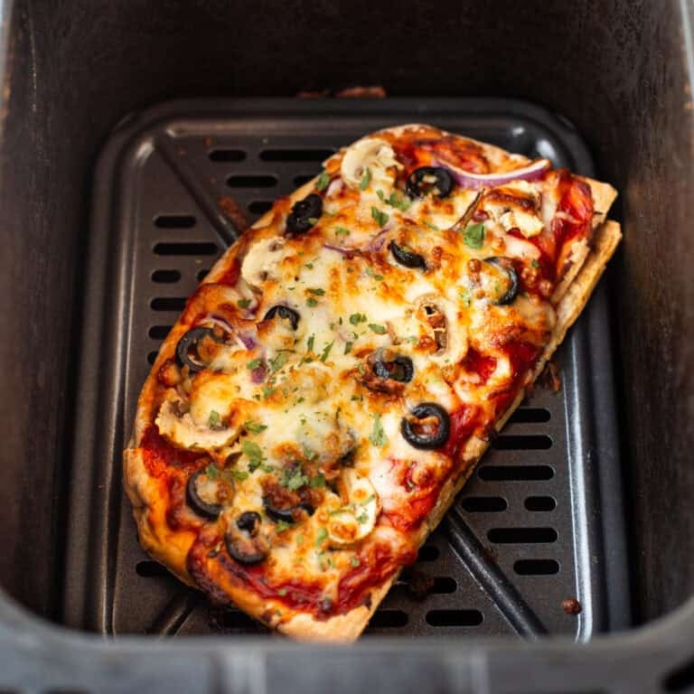 Vegetarian pitta bread pizza in an air fryer.