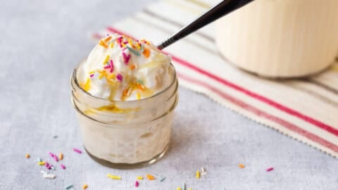 A small portion of cottage cheese ice cream with rainbow sprinkles.