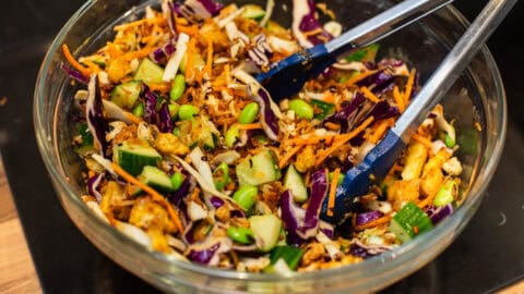Mixing bowl full of crispy rice and tofu salad.
