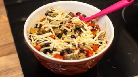 A bowl of roasted vegetable and cheese quesadilla filling.