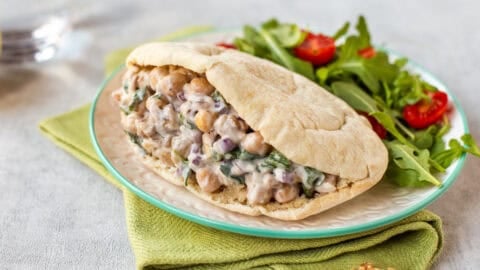 Creamy chickpea salad with goat cheese and walnuts in a pitta bread.