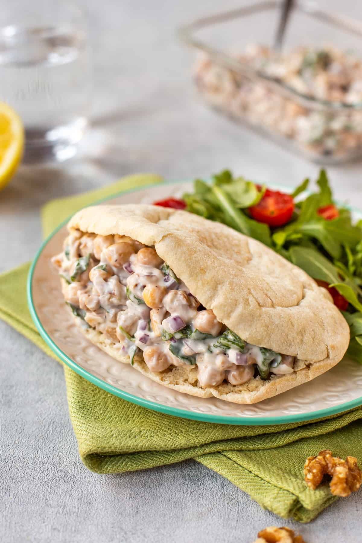 Lemony chickpea salad stuffed inside a pitta bread and served with salad.