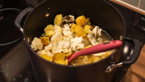 Potato, cauliflower and vegetable stock in a large saucepan.