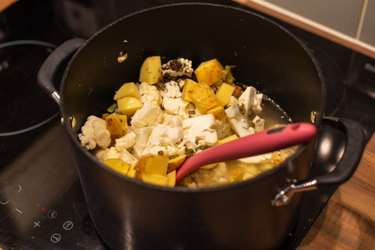 Potato, cauliflower and vegetable stock in a large saucepan.