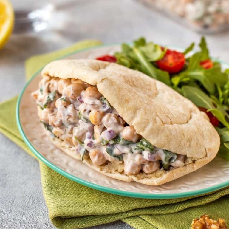 Lemony chickpea salad with walnuts and goat cheese stuffed in a pitta bread.