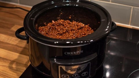 A slow cooker filled with lentil bolognese.