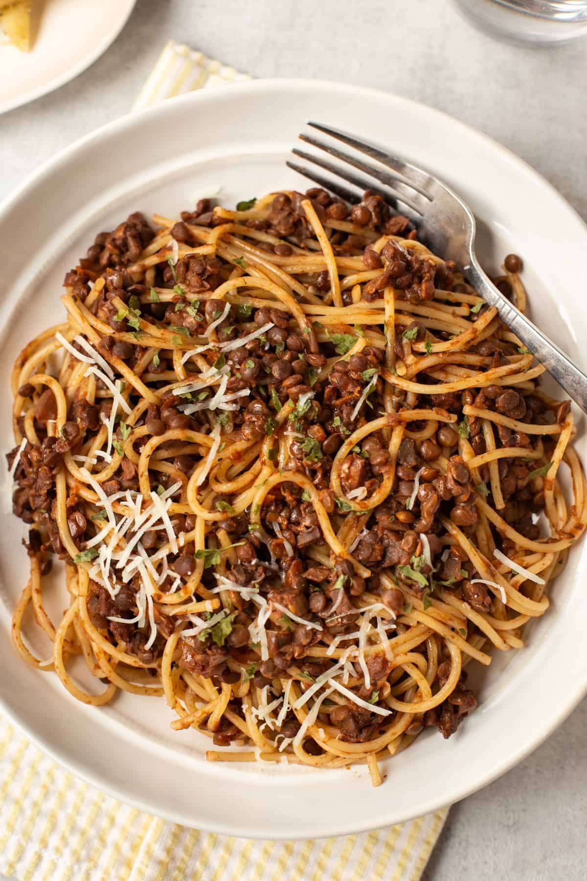 Overhead shot of a bowl of vegetarian spaghetti bolognese made with lentils.